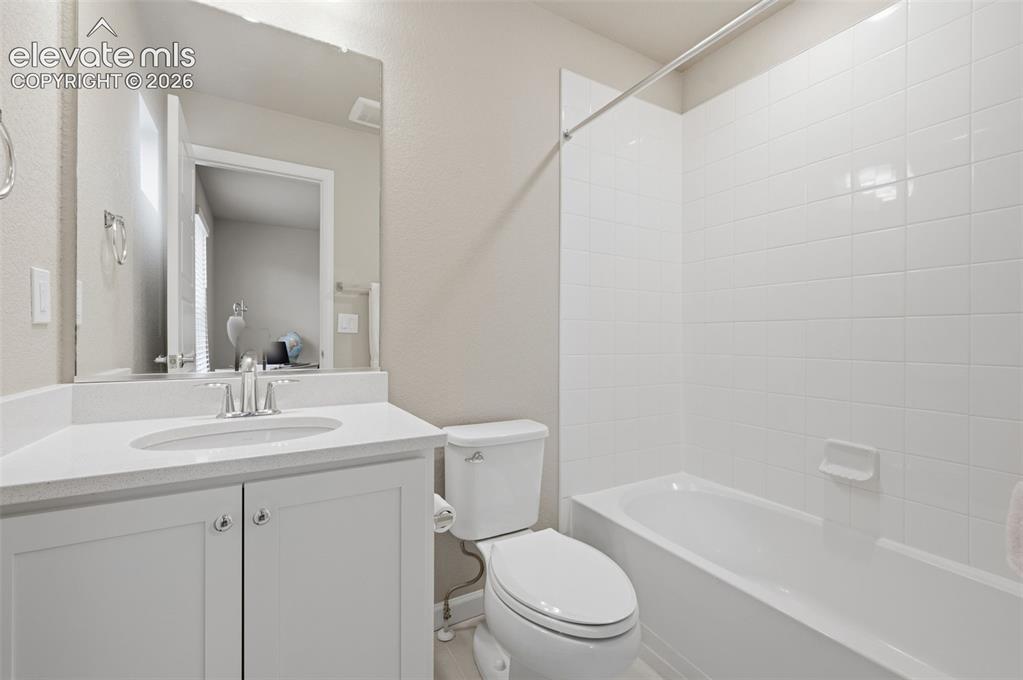 Image 9 of 24: Private full Bathroom adjoins bedroom #2 Both the floor and Tub/shower sur
