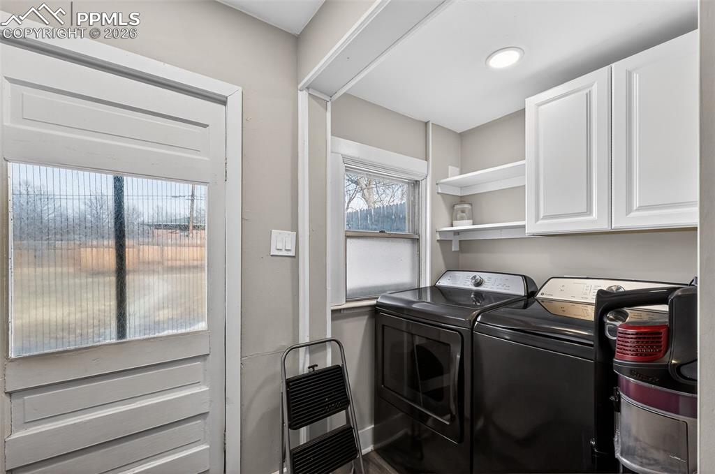 Image 12 of 34: Laundry area off Kitchen  