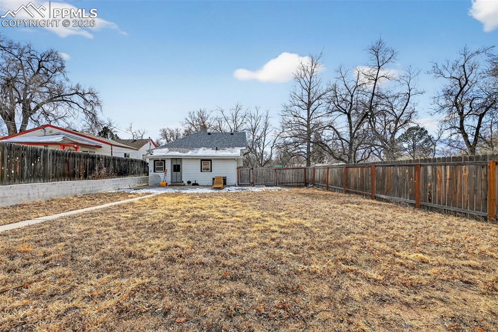 Image 21 of 34: Plenty of room to add onto the home or build a garage