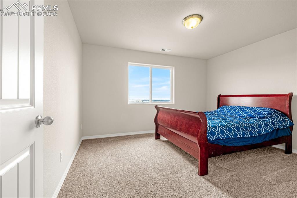 Image 28 of 37: Spacious Secondary bedroom upstairs with walk in closet