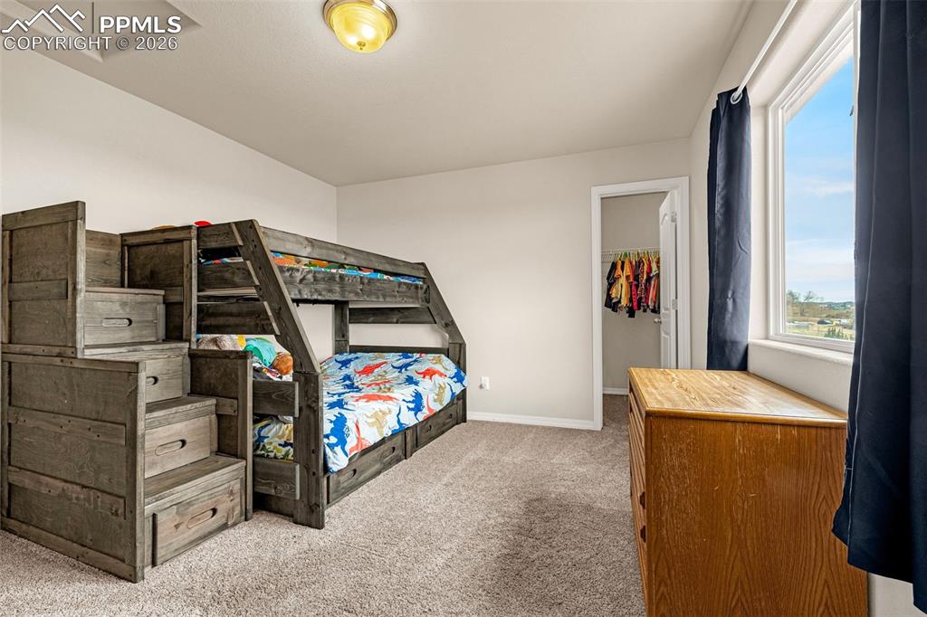 Image 29 of 37: Spacious Secondary bedroom upstairs with walk in closet