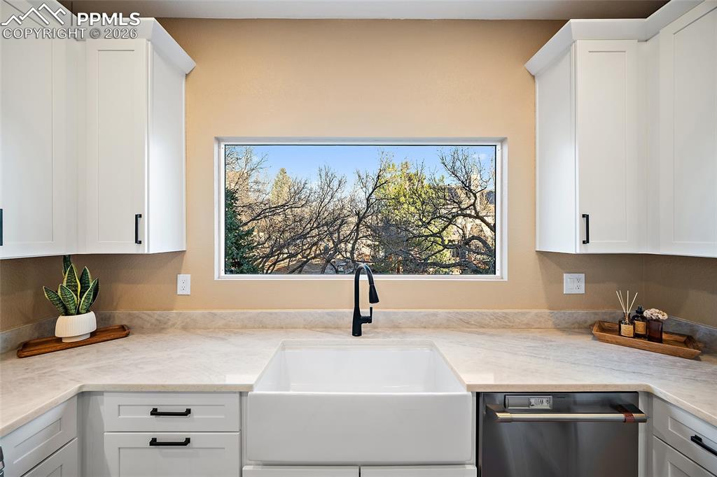 Image 12 of 50: Farmhouse inspired kitchen sink with awesome window and new soft close cabi