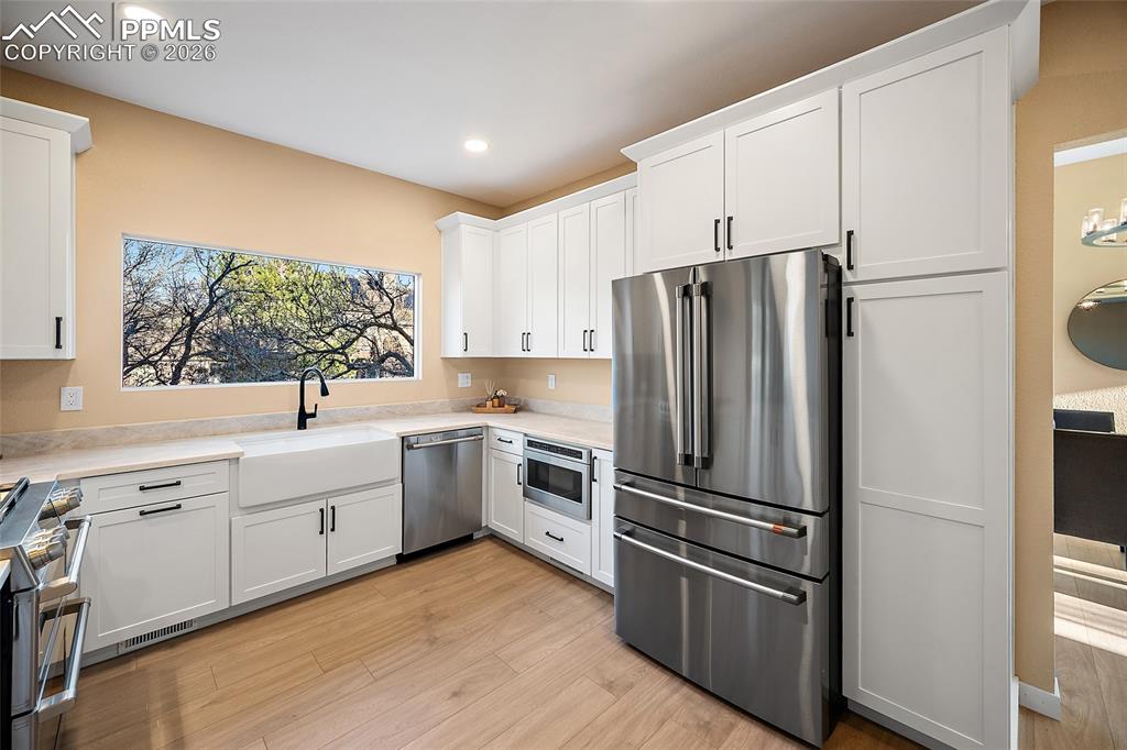 Image 13 of 50: View of kitchen from living room