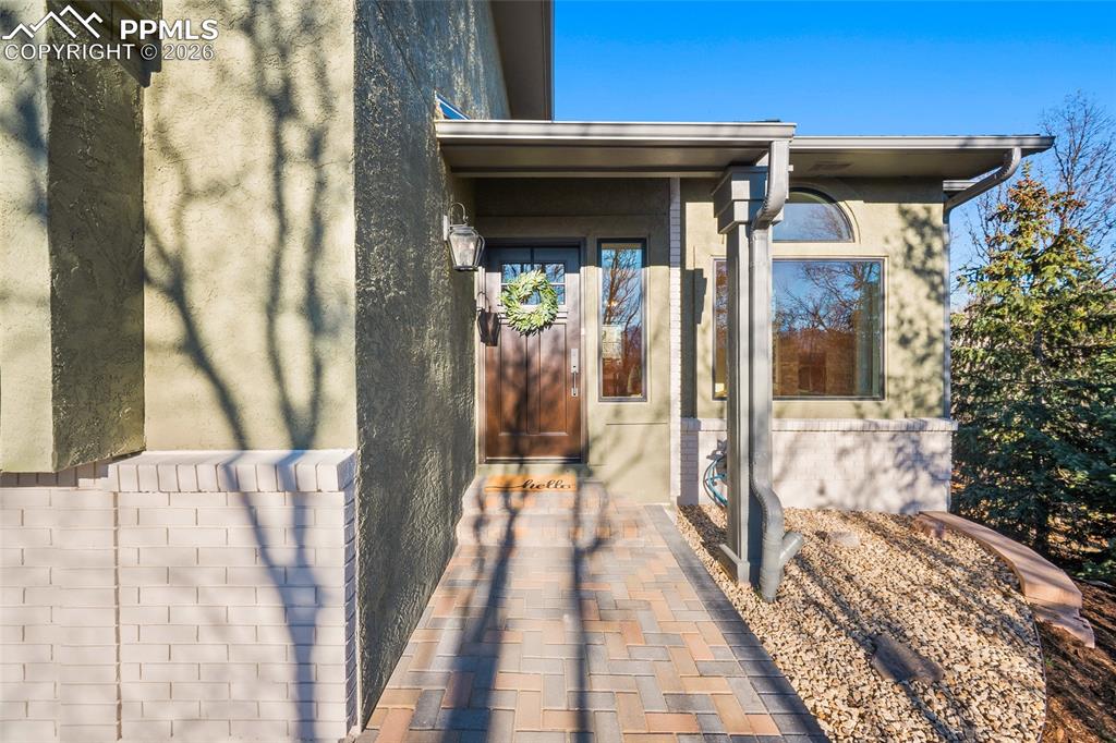 Image 3 of 50: View of exterior entry featuring stucco siding