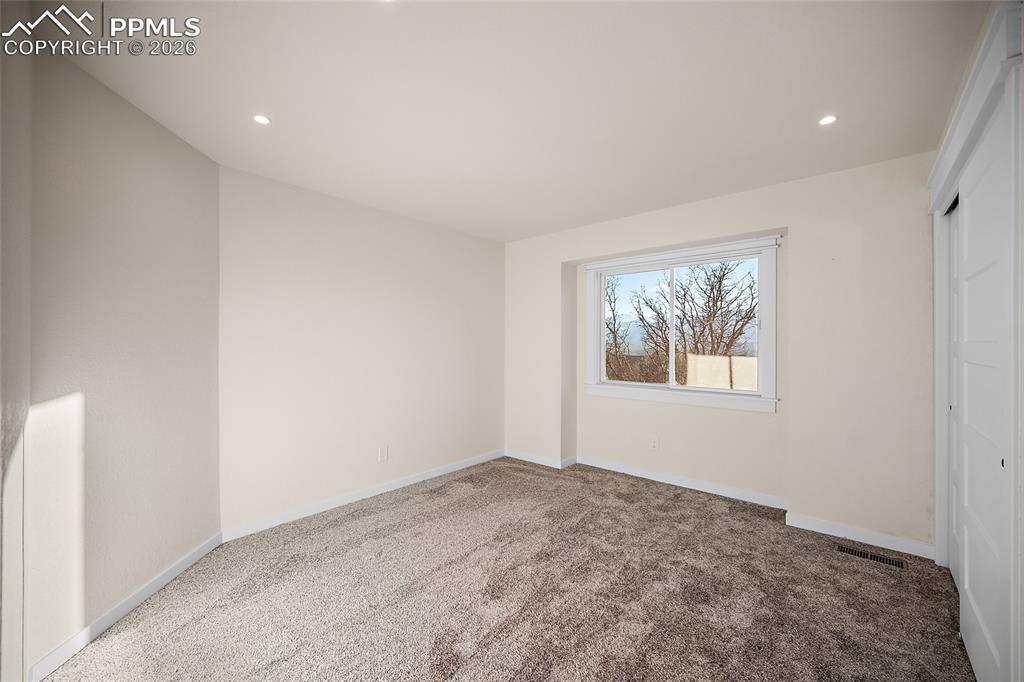Image 31 of 50: Third upstairs bedroom with stunning view of the mountains