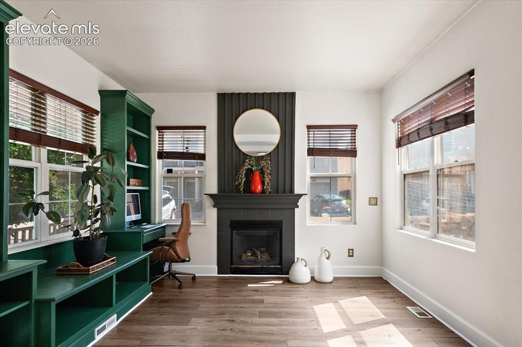 Image 13 of 47: Built-in desk & fireplace