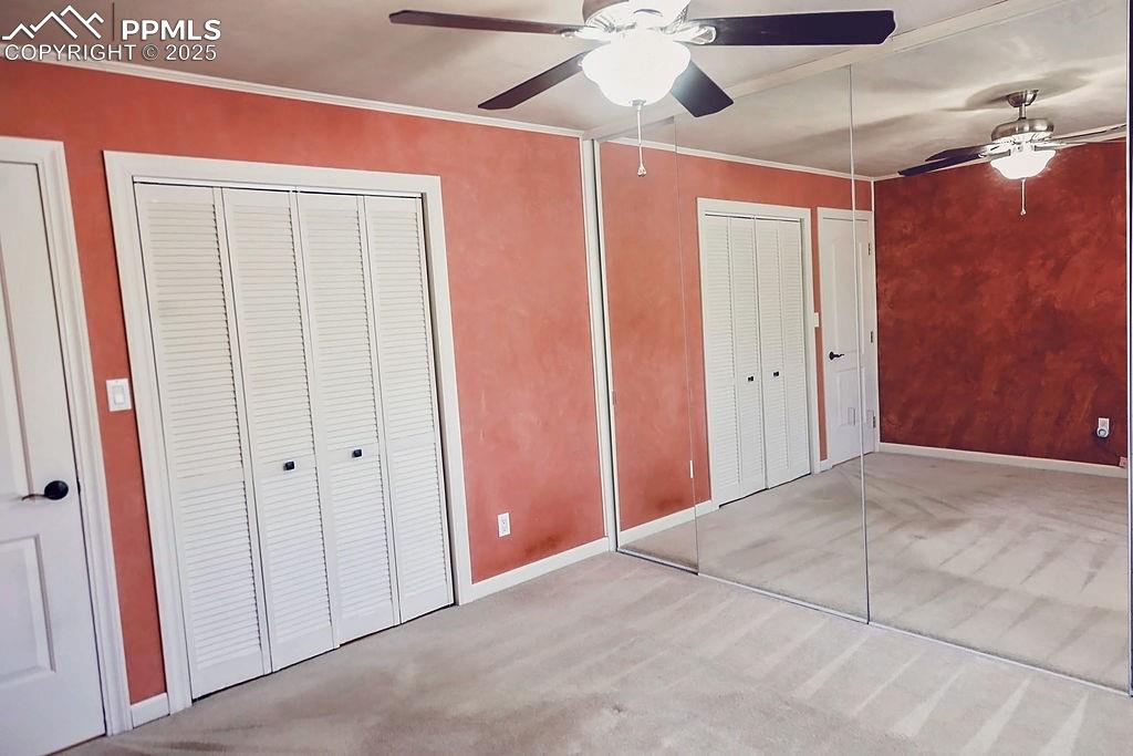 Image 11 of 50: Primary Bedroom w/ 2 Separate Closet Areas