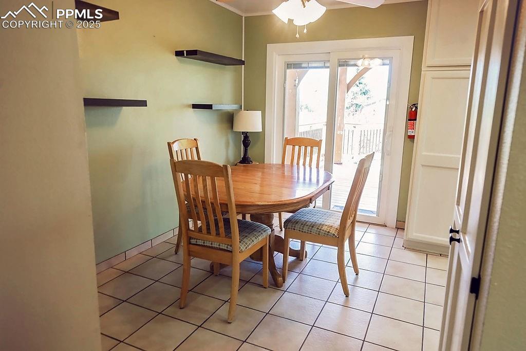 Image 21 of 50: Kitchen Eat-In Area with Ceiling Fan & Additional Recessed Lighting