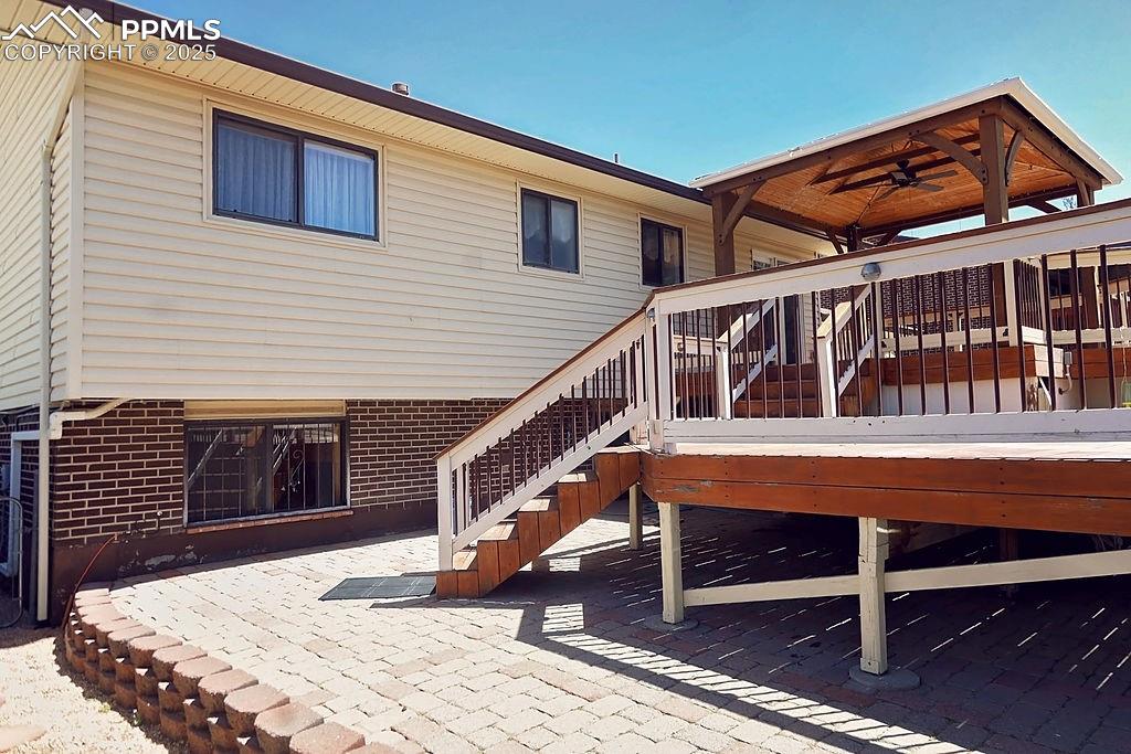 Image 31 of 50: Back Exterior (with Patio & 2-Level Decks)