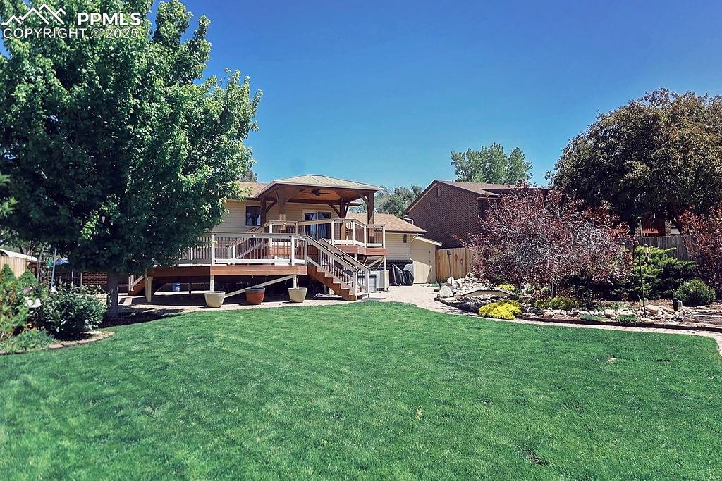 Image 34 of 50: Back Exterior & Yard