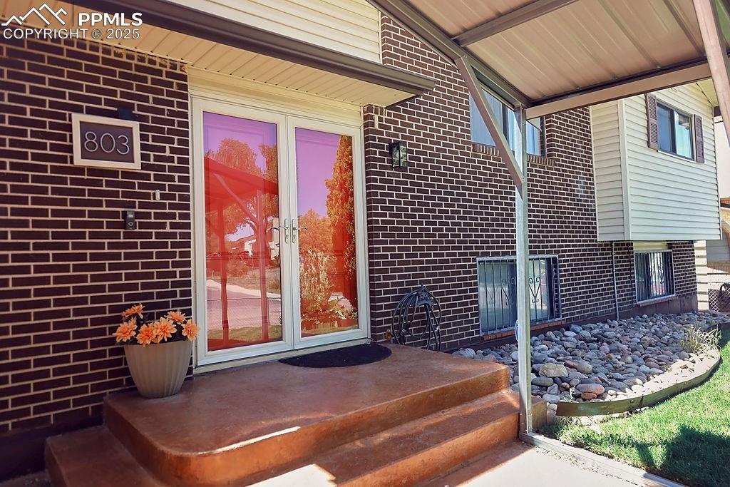 Image 4 of 50: Pella French Storm & Front Doors