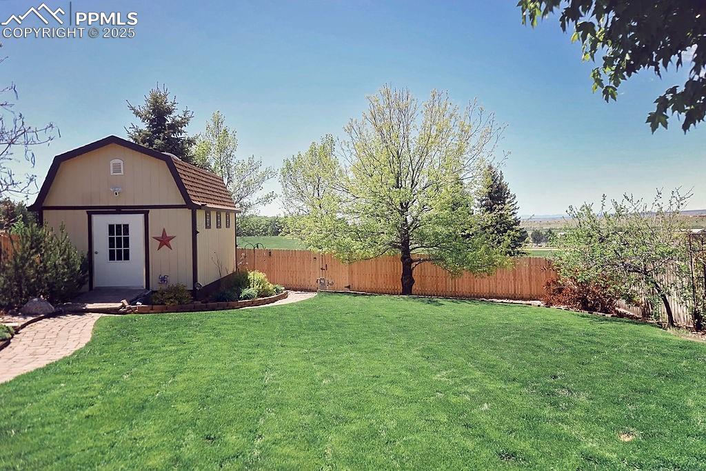 Image 41 of 50: Beautifully Landscaped, Fully Fenced Backyard