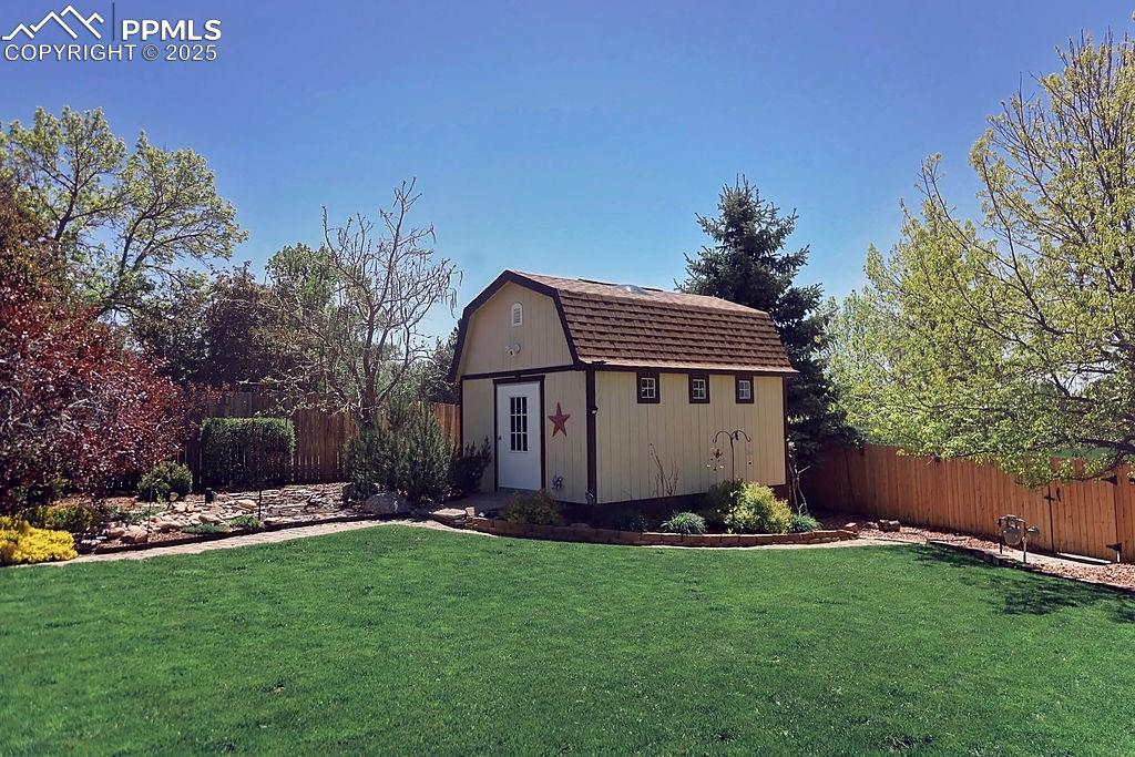 Image 42 of 50: Beautifully Landscaped, Fully Fenced Backyard
