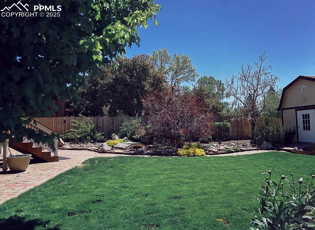 Image 44 of 50: Beautifully Landscaped, Fully Fenced Backyard