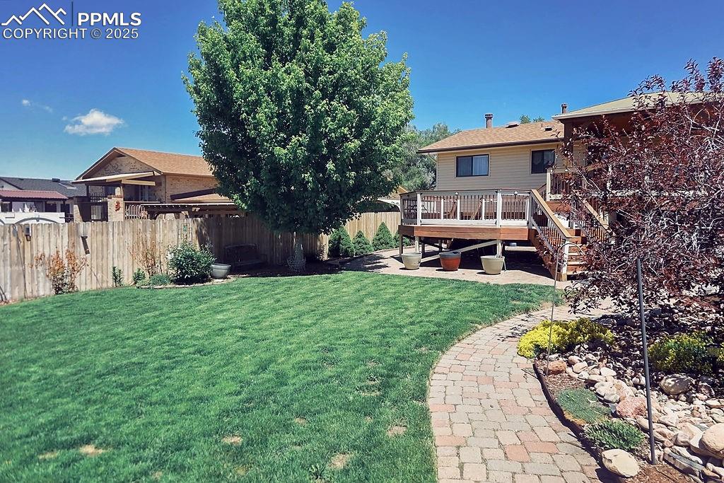 Image 45 of 50: Beautifully Landscaped, Fully Fenced Backyard