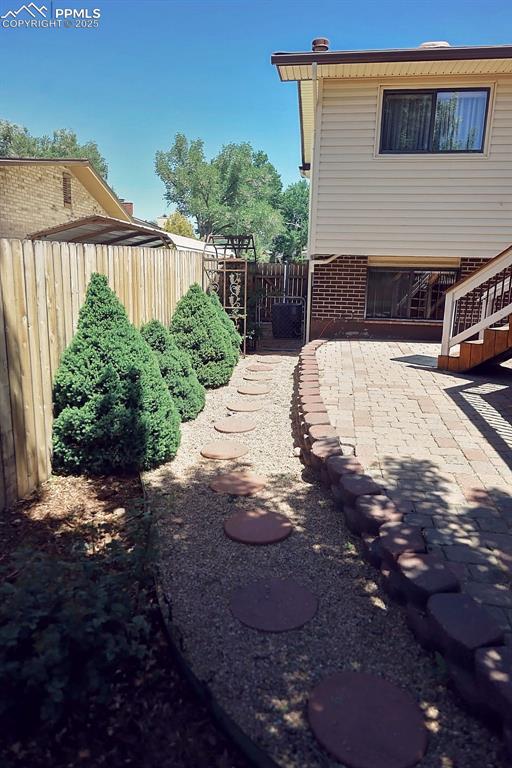 Image 46 of 50: Beautifully Landscaped, Fully Fenced Backyard