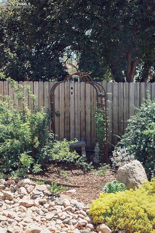 Image 48 of 50: Beautifully Landscaped, Fully Fenced Backyard