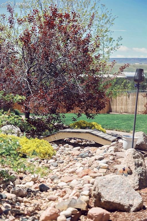 Image 49 of 50: Beautifully Landscaped, Fully Fenced Backyard