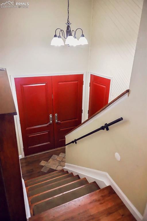 Image 5 of 50: Front Entry & Stairs