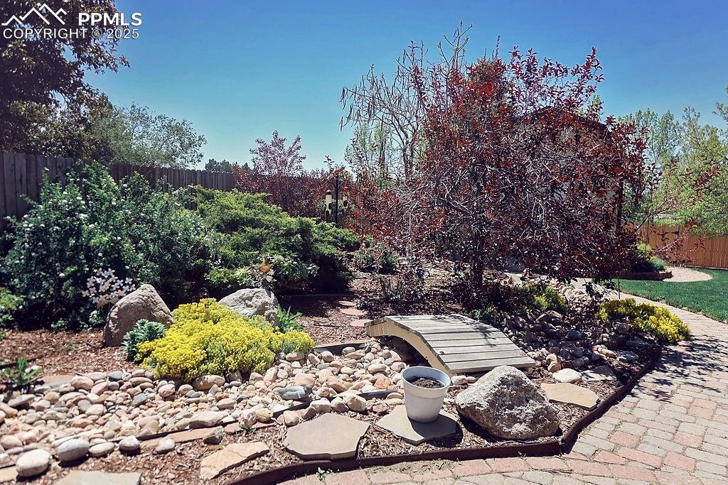 Image 50 of 50: Beautifully Landscaped, Fully Fenced Backyard