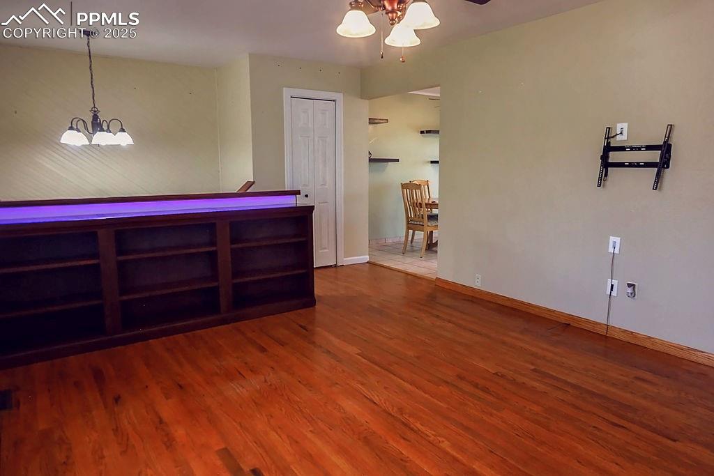 Image 8 of 50: Living Room w/ Built-In Book-shelving w/ Lights