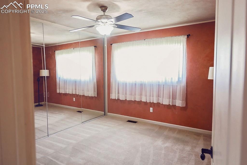 Image 9 of 50: Primary Bedroom w/ Ceiling Fan PLUS Low-Maintenance Clay Walls & Ceiling