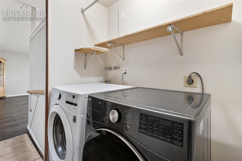 Image 11 of 27: Conveniently located laundry room