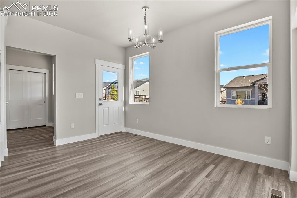 Image 14 of 43: Separate dining area with walk-out access to the backyard