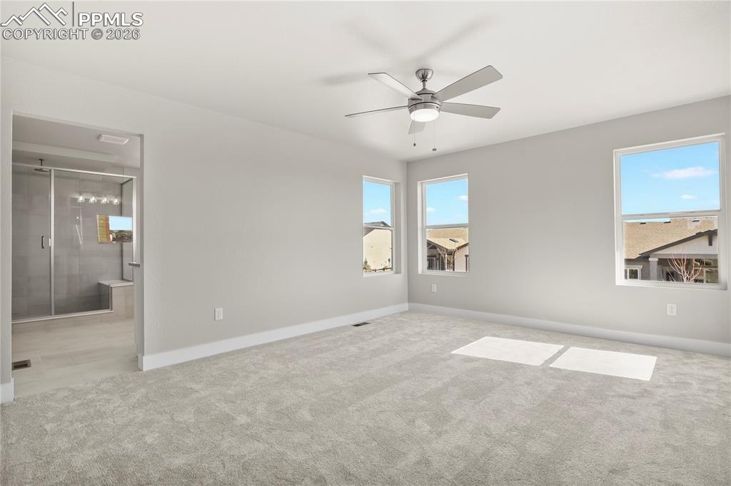 Image 23 of 43: Primary suite offers a spacious retreat