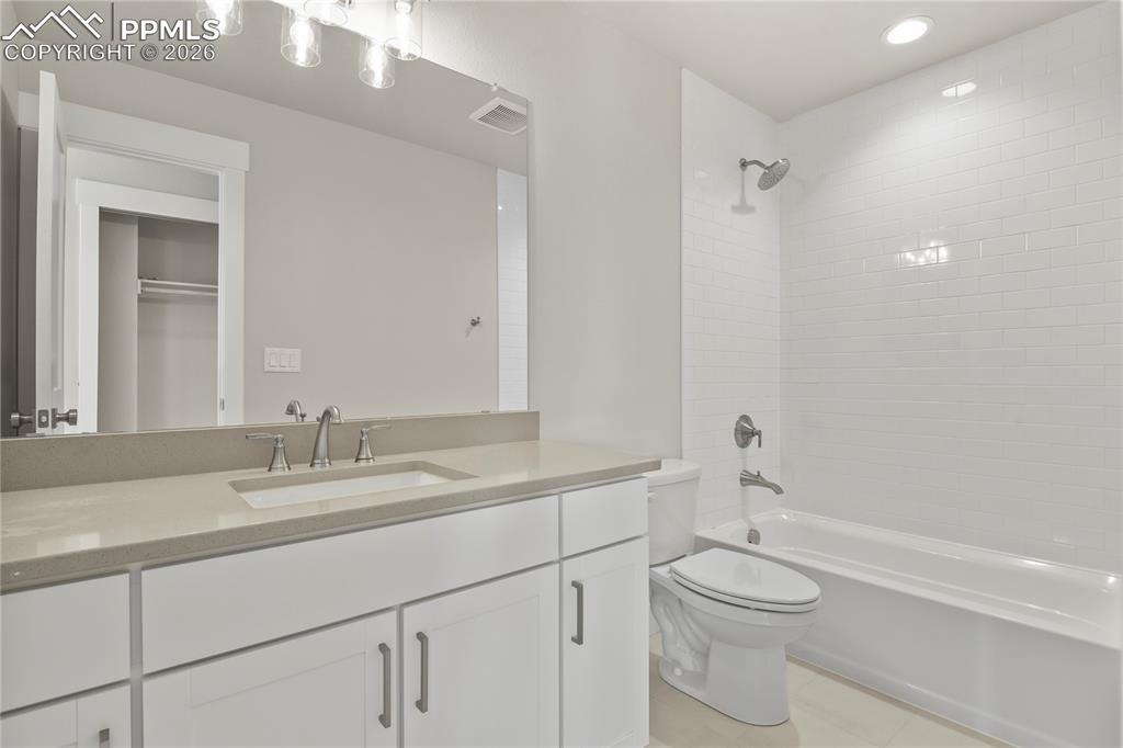 Image 30 of 43: Upper level hall bath