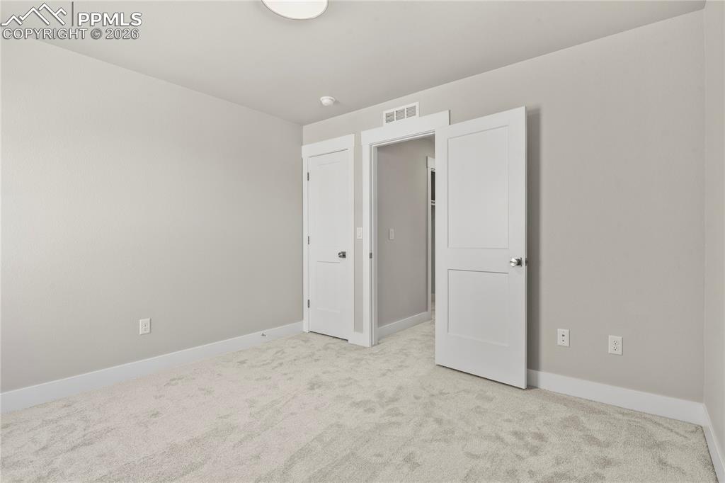 Image 32 of 43: Upper level bedroom