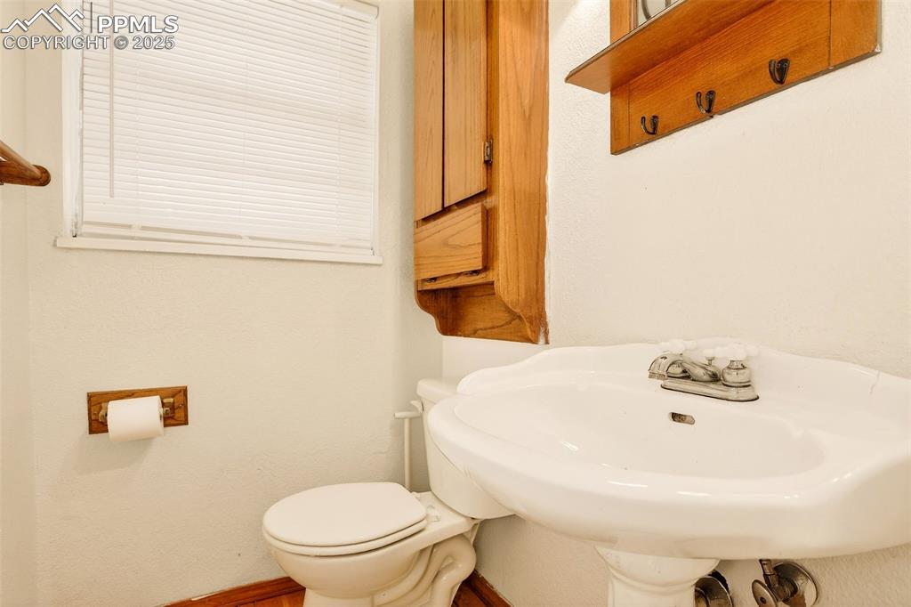 Image 27 of 37: Main level half bath