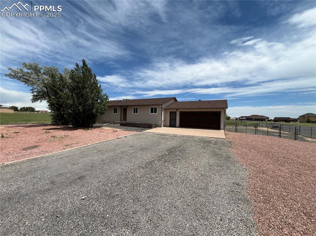 Caption: 3-bedroom, 2-bath ranch-style home, offering 2,570 square feet of living space on a large 1-acre lot