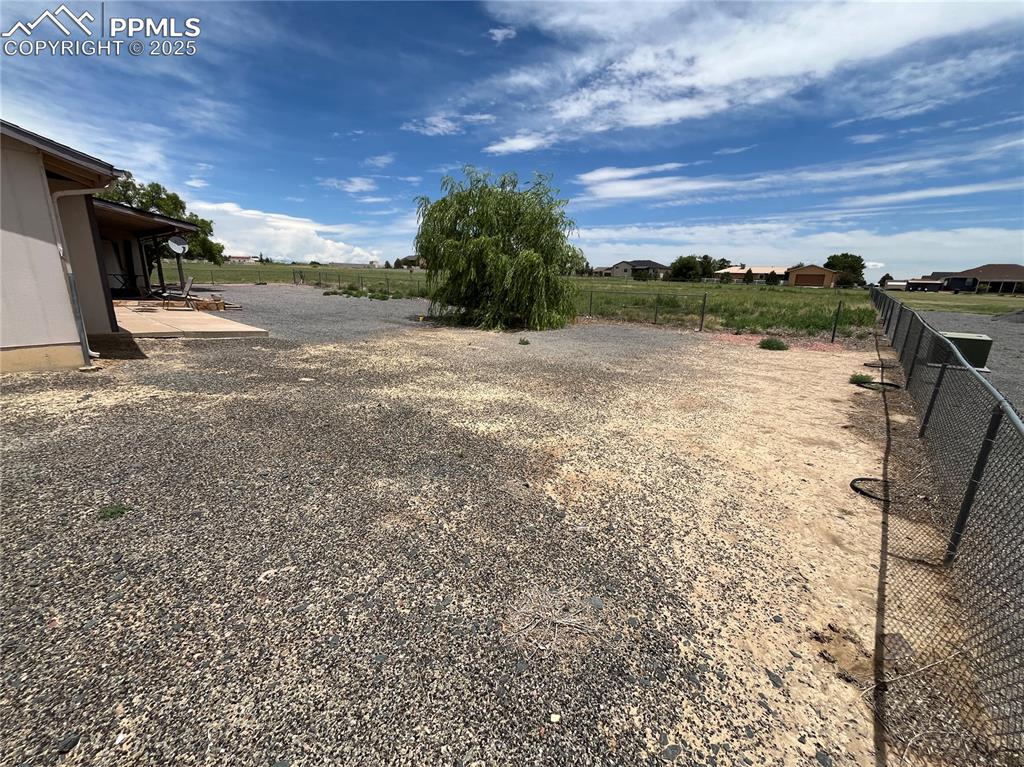 Image 5 of 21: Expansive lot with room for RV or small boat storage.