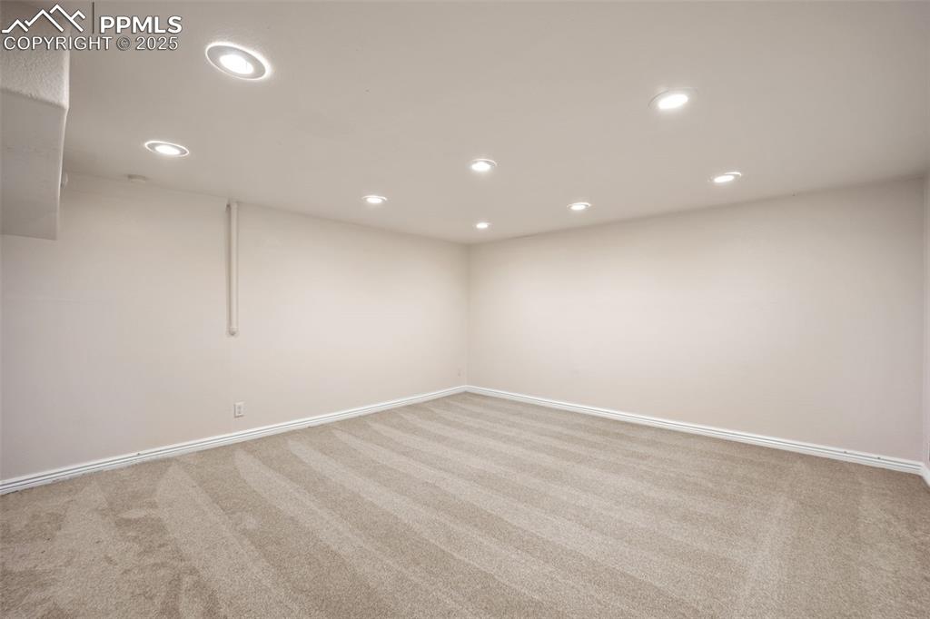 Image 31 of 31: Unfurnished room with carpet floors and recessed lighting