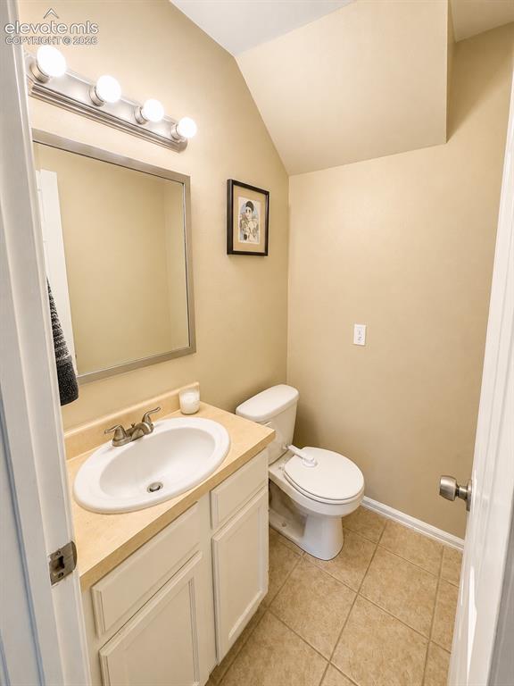 Image 10 of 27: Bathroom featuring a vanity with a laminate countertop, integrated sink, an