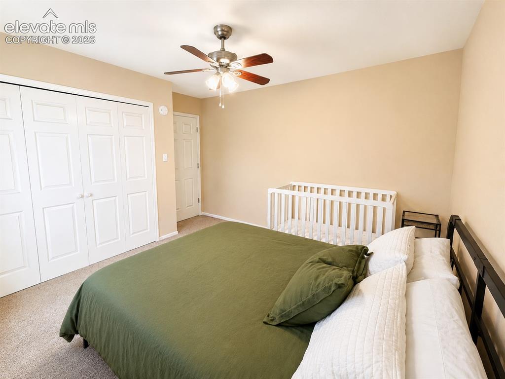 Image 18 of 27: Bedroom featuring neutral-toned walls and carpet flooring