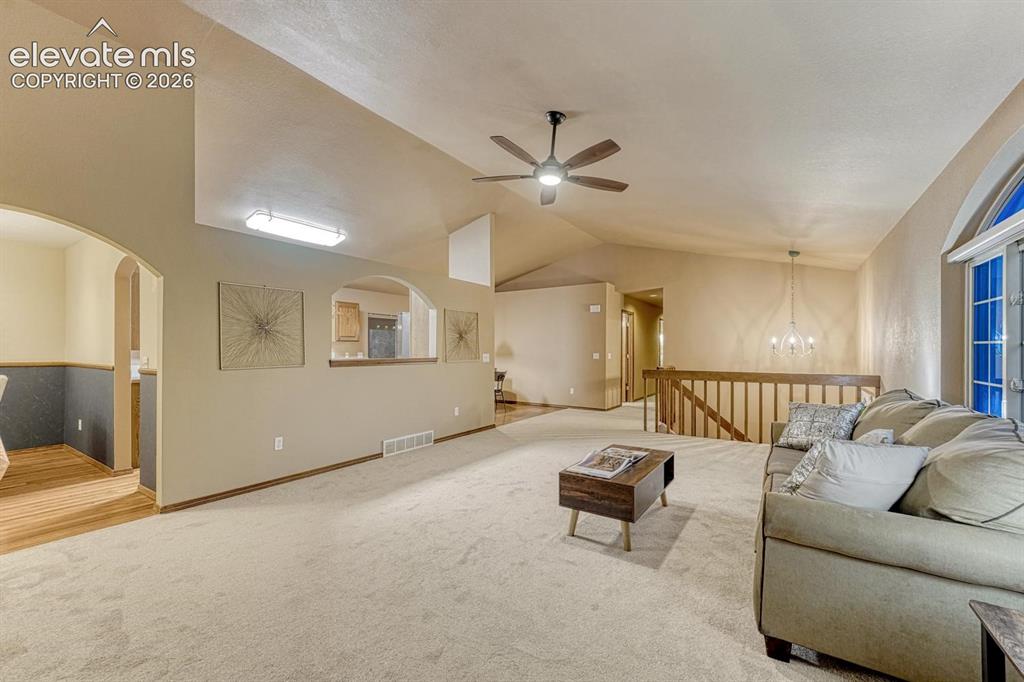Image 11 of 46: Living room with Formal dining to the left and eat in kitchen and foyer