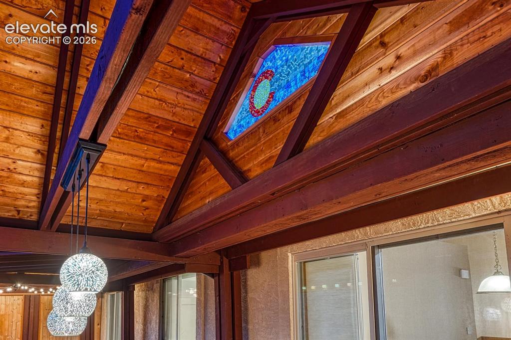 Image 25 of 46: custom stained glass on covered deck