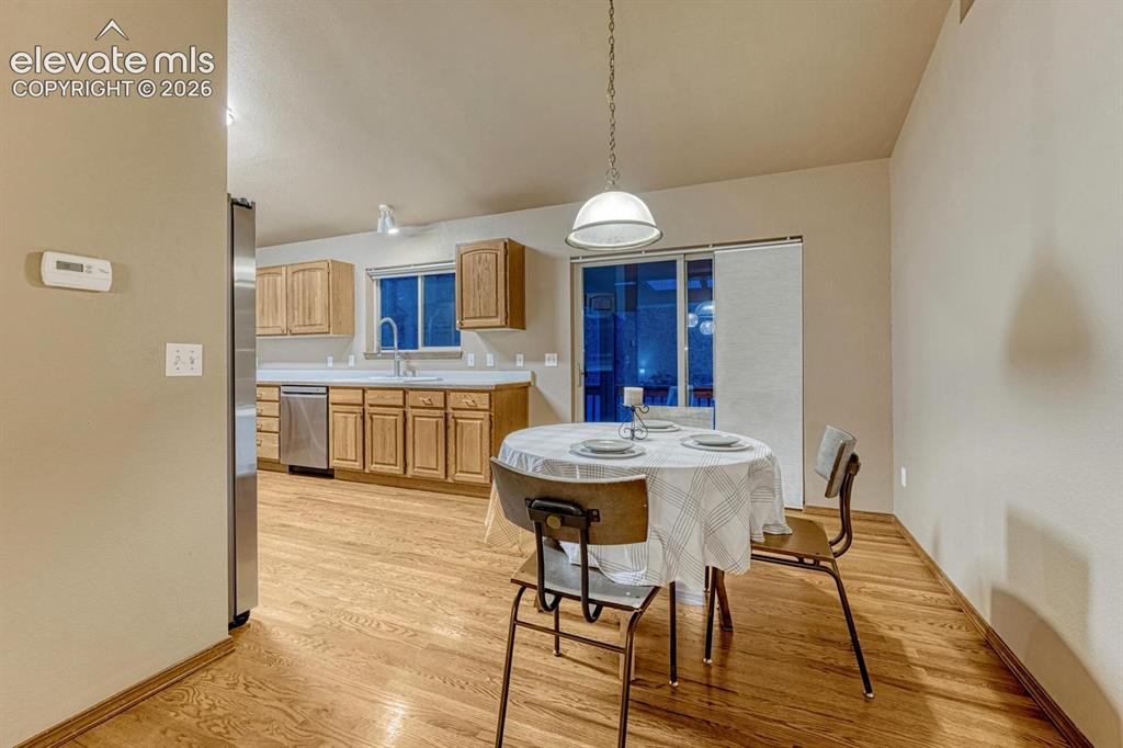 Image 4 of 46: Eat in kitchen with walk out to HUGE covered deck