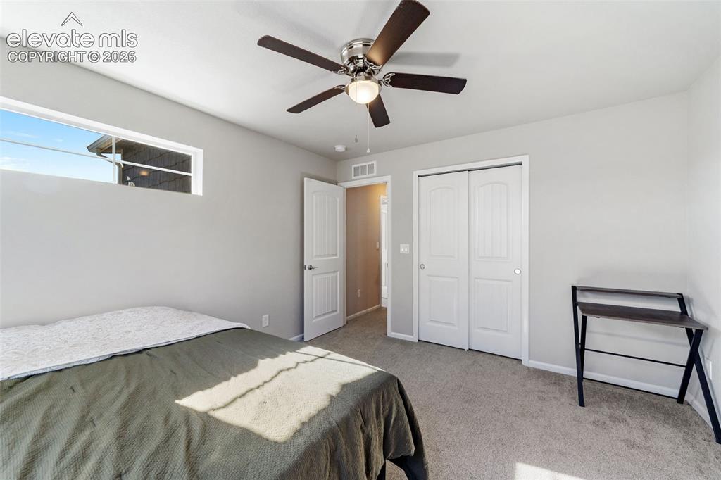 Image 11 of 21: Well-sized secondary bedroom with closet storage.