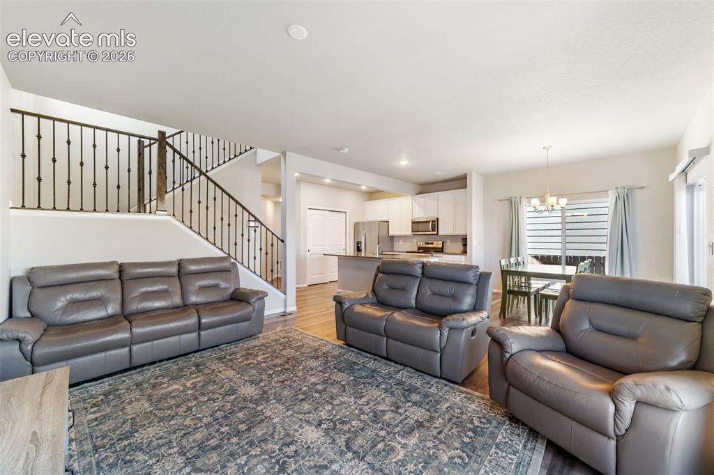 Image 3 of 21: Spacious open-concept living room with abundant natural light and seamless