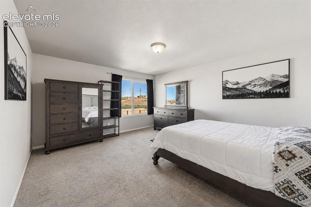 Image 7 of 21: Spacious primary suite with abundant natural light.