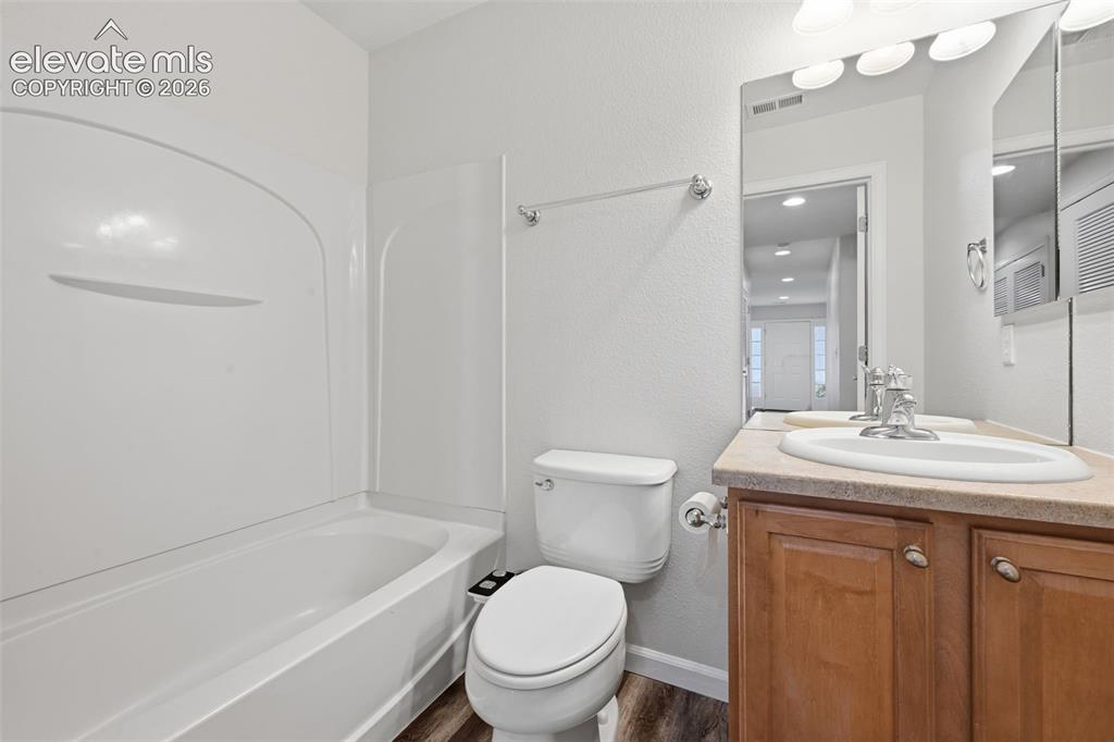 Image 13 of 28: Entry level bathroom closest to garage 
