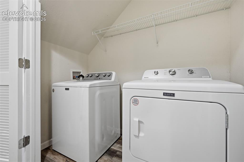 Image 14 of 28: Entry level laundry same level as garage 