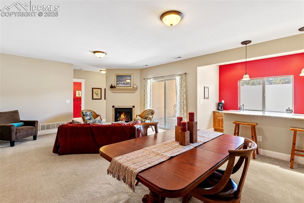 Image 26 of 39: Family room with walk out and wet bar