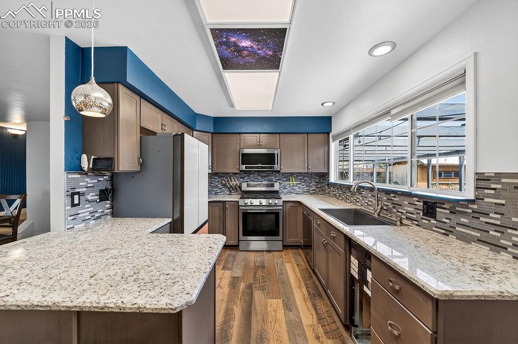 Image 15 of 46: The new cabinets provide generous storage and add to the kitchen’s appeal.
