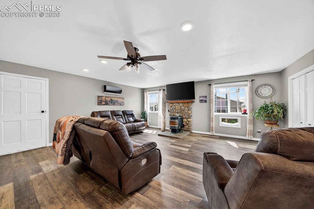 Image 7 of 46: Living room windows updated with a built-in pet window.
