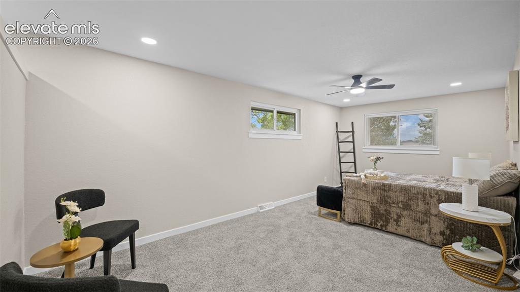 Image 17 of 45: Spacious room featuring light-toned walls, white trim, recessed lighting, a