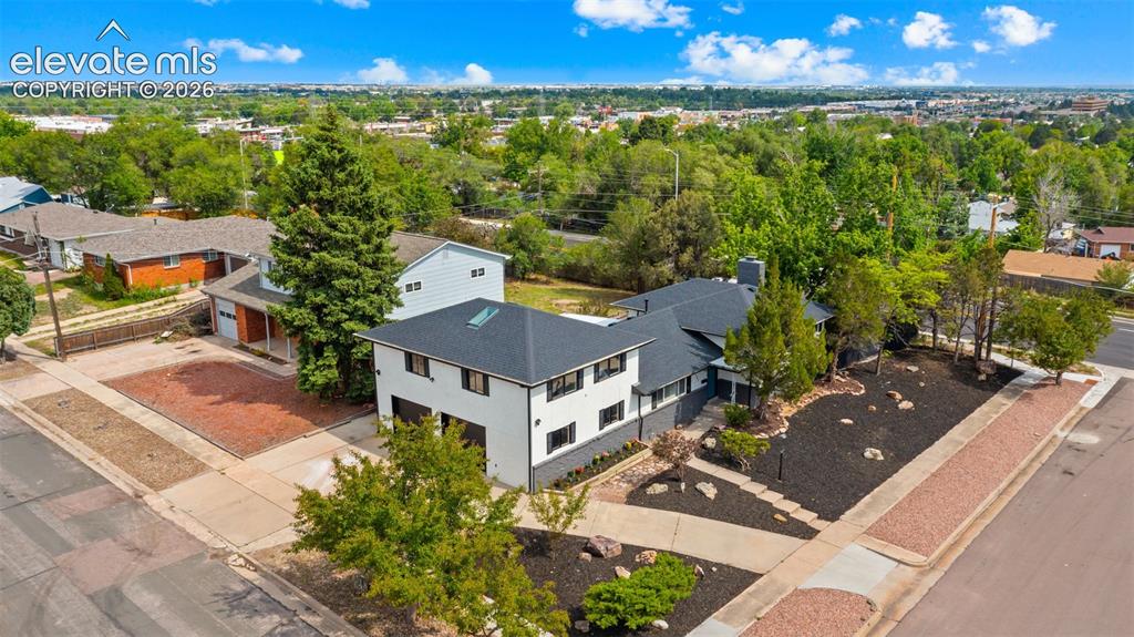 Image 37 of 45: Modern two-story residence with a multi-gabled roofline and a contemporary